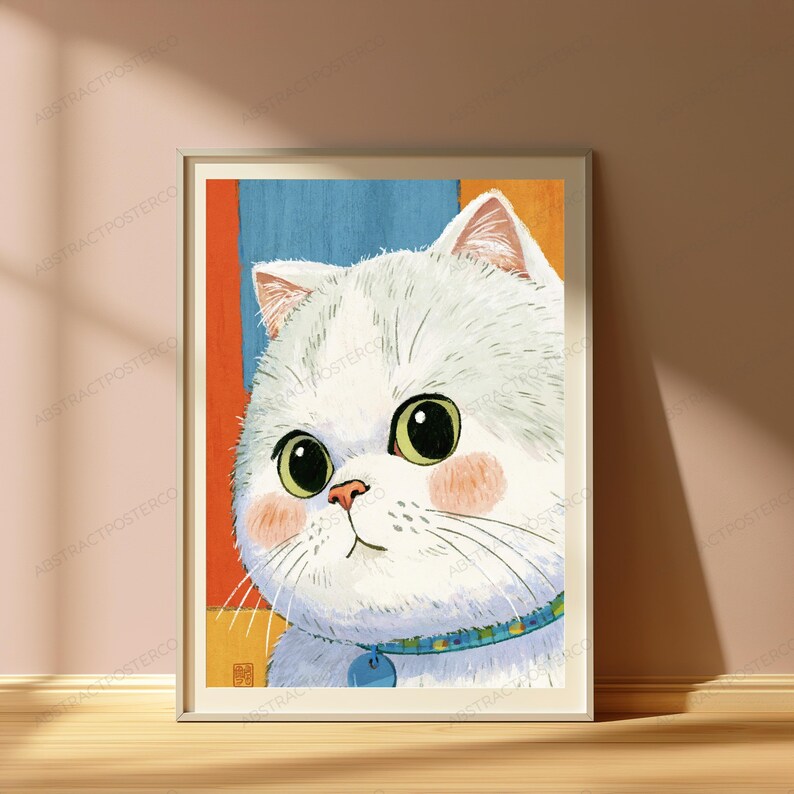 May include: A framed art print featuring a stylized illustration of a fluffy white cat with large green eyes and pink cheeks. The cat wears a blue patterned collar with a small tag. The background consists of vertical orange and blue color blocks.