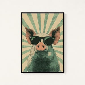 May include: A framed wall art print featuring a stylised illustration of a pig wearing black sunglasses. The pig is centred against a background of alternating beige and teal sunburst rays with a subtle dot pattern throughout the design.
