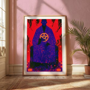 May include: A framed vertical art print featuring a dark blue silhouette of a seated figure wearing a patterned robe against a vibrant red background. The figure holds a glowing orange pentagram symbol, with smaller pentagrams on the ground.