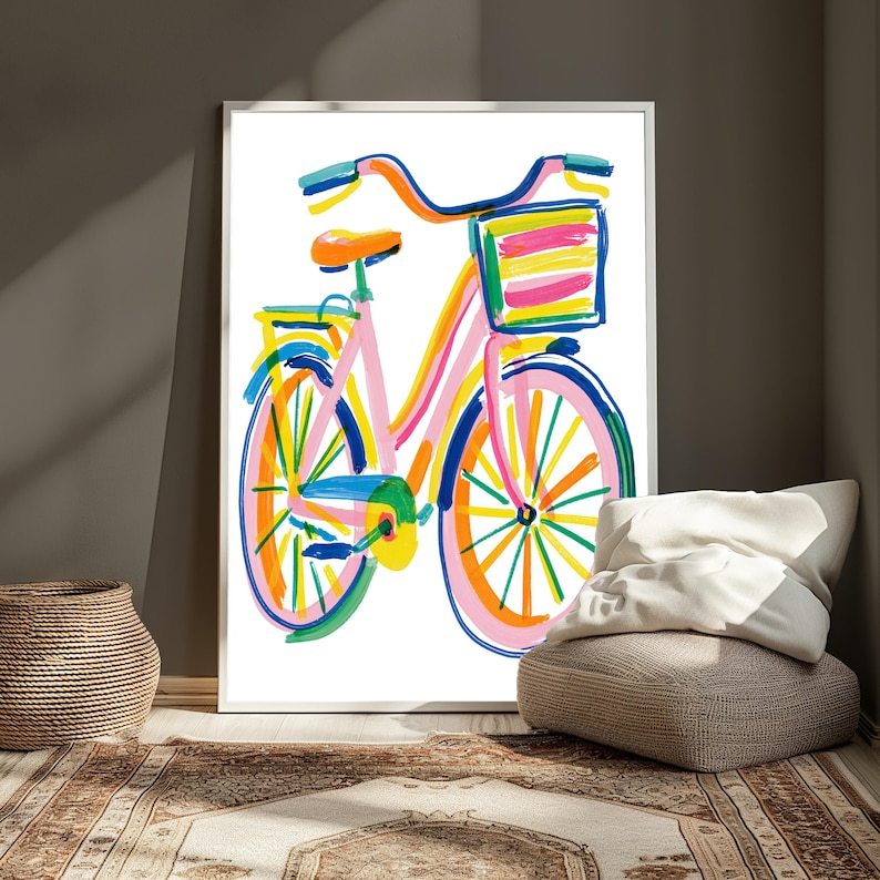 May include: A framed art print featuring a colorful, painterly illustration of a bicycle. The bicycle is rendered in vibrant brushstrokes of pink, orange, yellow, blue, and green, complete with a front basket and a rear rack on a white background.