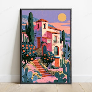 May include: A framed art print depicting a multi-story pink villa with a red tiled roof, surrounded by orange trees and various cacti. A stone staircase leads to the entrance under a yellow sun in a purple sky, featuring a landscape of distant hills.