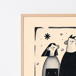 May include: A framed wall art print featuring a black ink illustration of two figures with stippled shading on a light cream background. The artwork is enclosed in a light-coloured wooden frame and includes simple graphic elements like stars.