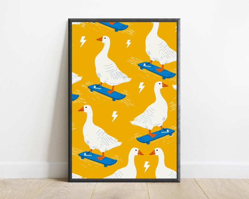 May include: A framed art print featuring a repeating pattern of white geese with orange beaks and feet riding blue skateboards on a vibrant mustard yellow background, interspersed with small white lightning bolt icons throughout the design.