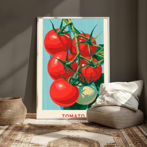 May include: A framed vertical art print featuring a cluster of bright red tomatoes on a green vine against a background of vertical light blue and white stripes. The word TOMATO is printed in red capital letters at the bottom of the illustration.