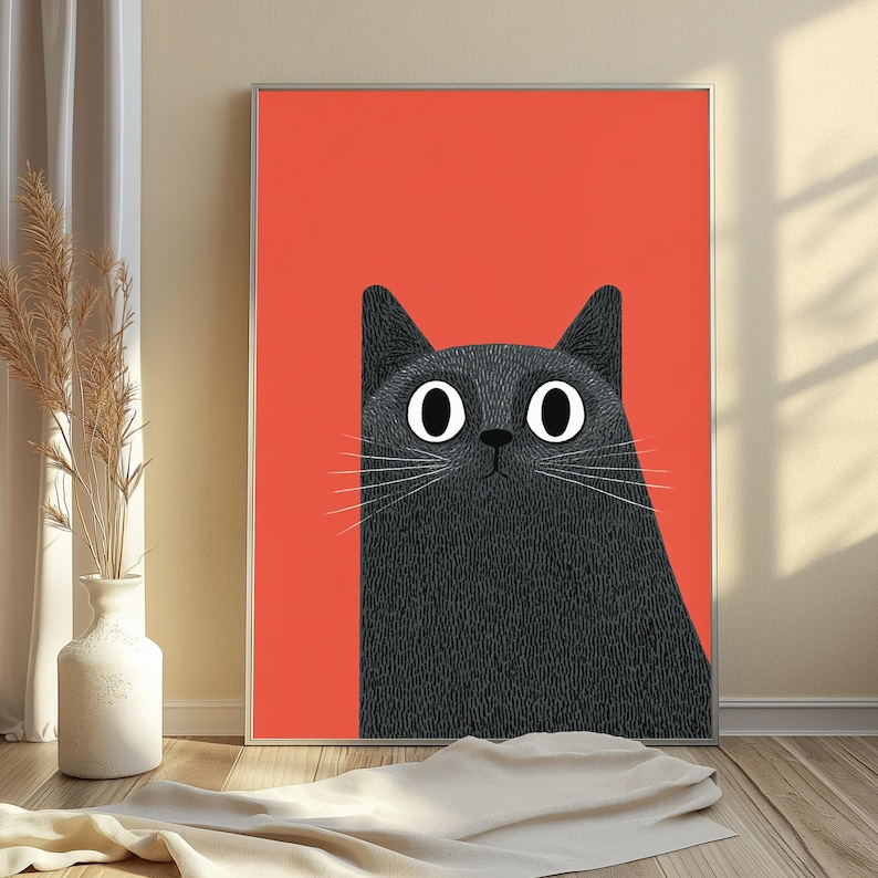 May include: A rectangular framed wall art print featuring a stylized illustration of a black cat with large white eyes and long white whiskers set against a solid, vibrant orange background. The cat has a textured appearance with fine lines.