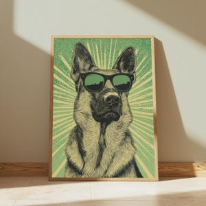 K&ouml;nnte beinhalten: Ein gerahmter Kunstdruck mit einer detaillierten Illustration eines Deutschen Sch&auml;ferhundes, der eine schwarze Sonnenbrille tr&auml;gt. Der Hund ist vor einem hellgr&uuml;nen Hintergrund mit strahlenf&ouml;rmigem Muster und punktiertem Effekt zentriert.