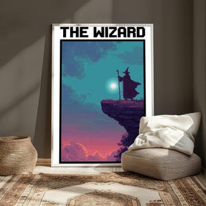 May include: A framed pixel art poster titled THE WIZARD featuring a silhouette of a robed figure with a pointed hat and staff standing on a cliff edge against a gradient sky of teal, purple, and pink with a bright circular sun or moon.