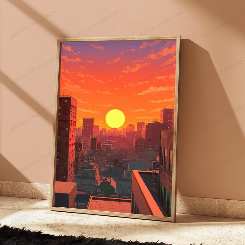May include: A rectangular framed wall art print featuring a digital illustration of a city skyline at sunset. The scene displays a bright yellow sun centred above dense urban buildings, with a vibrant orange and red sky filled with soft clouds.