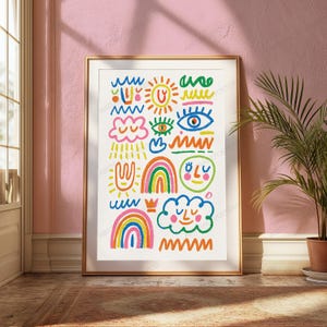 May include: A framed wall art print featuring a white background with colourful hand-drawn illustrations including a sun, rainbows, clouds, eyes, a face, and various wavy lines in shades of blue, green, yellow, orange, pink, and red.