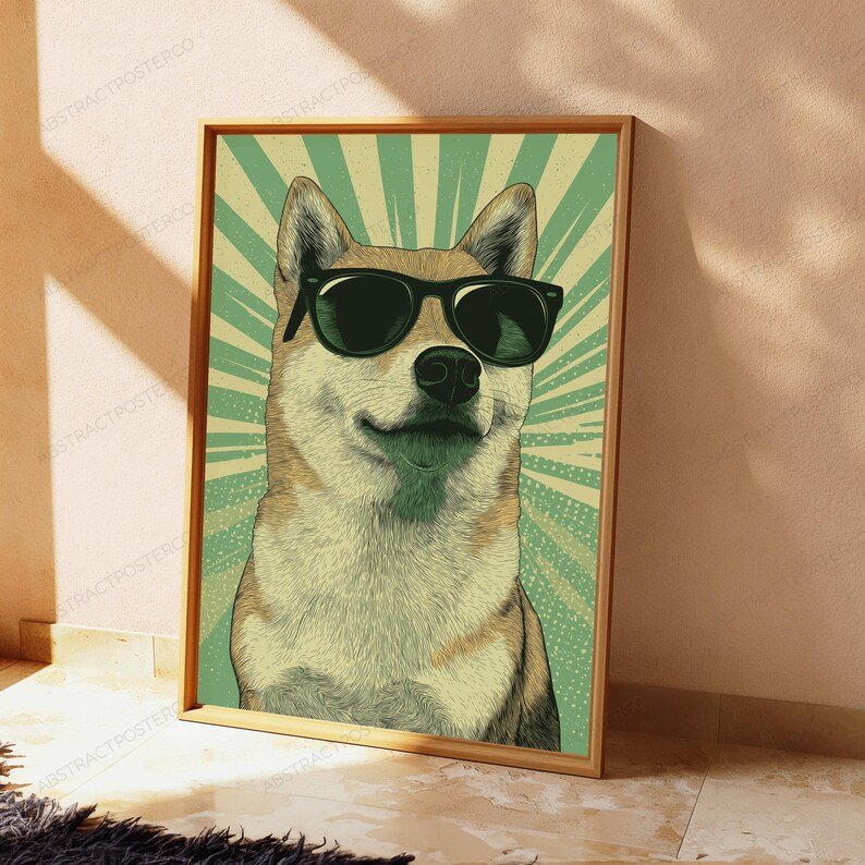 May include: A framed wall art print featuring a tan and white Shiba Inu dog wearing black sunglasses. The background consists of a light green and white sunburst pattern with a subtle dotted texture, all enclosed in a simple wooden frame.