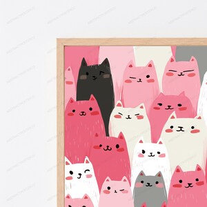 May include: A framed wall art print featuring a dense, repeating pattern of stylized cats in shades of pink, white, gray, and black. The cats have simple facial features, including small eyes, noses, and mouths, with some winking or sleeping.