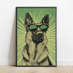May include: A framed wall art print featuring a detailed illustration of a German Shepherd dog wearing black sunglasses. The dog is centered against a green background with a radiating sunburst pattern in light yellow and dark green stippled texture.