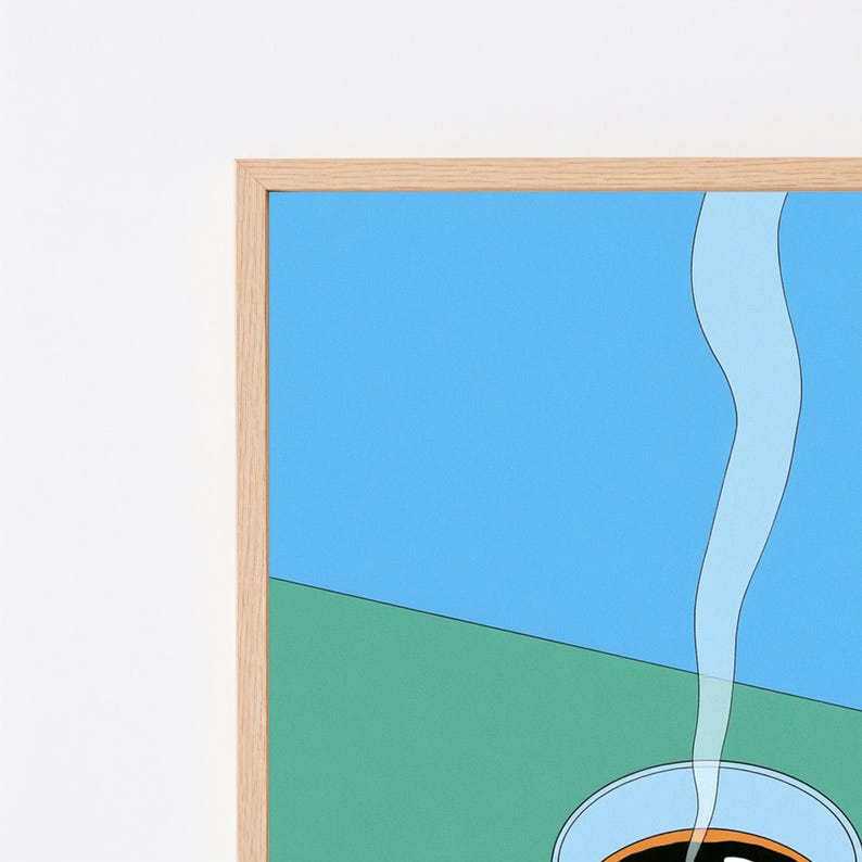May include: A framed wall art print featuring a stylised illustration of a cup of coffee with rising steam. The composition is divided into a bright blue upper section and a green lower section, all enclosed within a light-toned wooden frame.