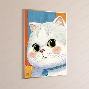 May include: A framed wall art print featuring a stylized illustration of a white cat with large green eyes, pink cheeks, and a blue collar with a round tag. The background consists of vertical blocks of blue and orange, with a small red square seal.
