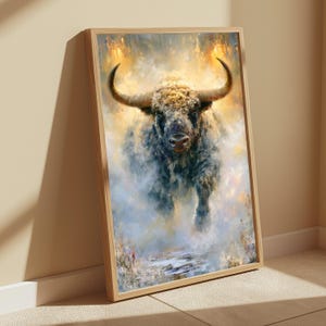May include: A framed vertical wall art print featuring a textured, painterly depiction of a bull with large, curved horns. The bull is rendered in shades of dark gray, brown, and cream, emerging from a hazy, golden, and light blue atmospheric background.