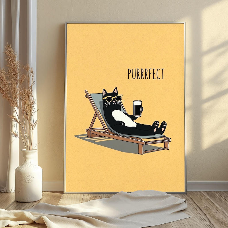 May include: A framed wall art print featuring a black and white cat wearing yellow sunglasses, lounging on a wooden deck chair while holding a glass of dark beverage. The background is a solid yellow color with the text PURRRFECT printed above.