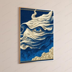 May include: A rectangular wall art print in a gold frame featuring a surreal illustration of a single blue eye emerging from swirling, cream-colored fabric-like clouds against a deep blue, stippled background with a thin gold border.
