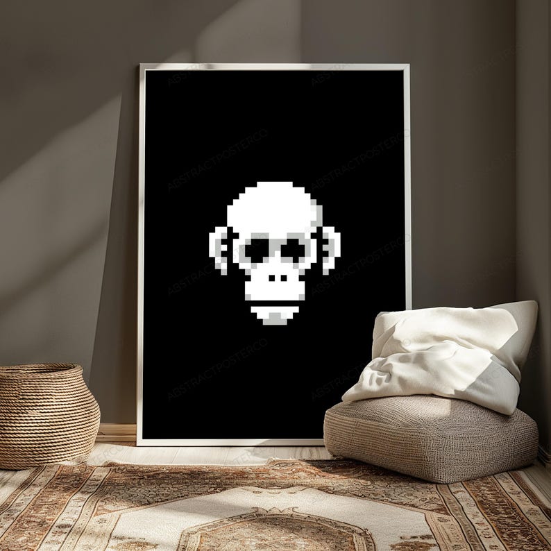 May include: A rectangular wall art print featuring a white pixelated monkey face centered on a solid black background. The monkey design is composed of square blocks, creating a digital aesthetic with a clear, high-contrast monochromatic color scheme.