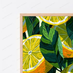 May include: A framed wall art print featuring a vibrant pattern of sliced yellow lemons and deep green leaves. The illustration displays citrus fruit segments with detailed textures and bold colors, encased in a light-toned wooden frame.