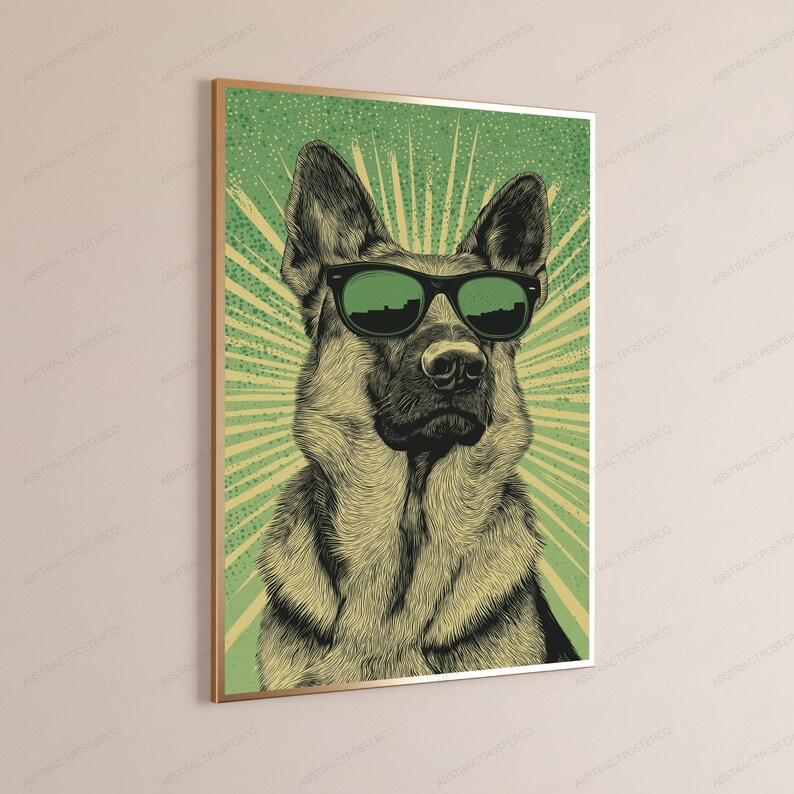 May include: A framed wall art print featuring a detailed illustration of a German Shepherd dog wearing black sunglasses. The dog is centered against a green background with a radiating sunburst pattern in a lighter shade of green and yellow.