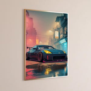 May include: A framed wall art print featuring a dark grey sports car with yellow headlights parked on a wet city street at night. The scene includes glowing neon signs, tall buildings, and reflections on the ground in a vibrant urban setting.