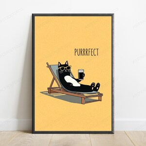 May include: A framed wall art print featuring a black and white cat wearing yellow sunglasses, lounging on a wooden deck chair while holding a dark beverage. The background is a solid yellow color with the text PURRRFECT printed in black above the cat.