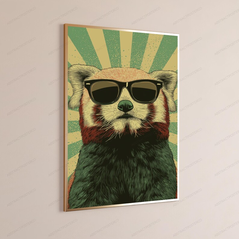 May include: A framed wall art print featuring a stylized illustration of a red panda wearing black sunglasses. The background consists of a sunburst pattern in alternating shades of light green and beige, with a textured, vintage-inspired aesthetic.