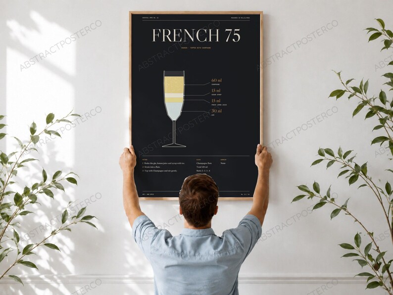French 75 Cocktail Recipe Print, held up in a room