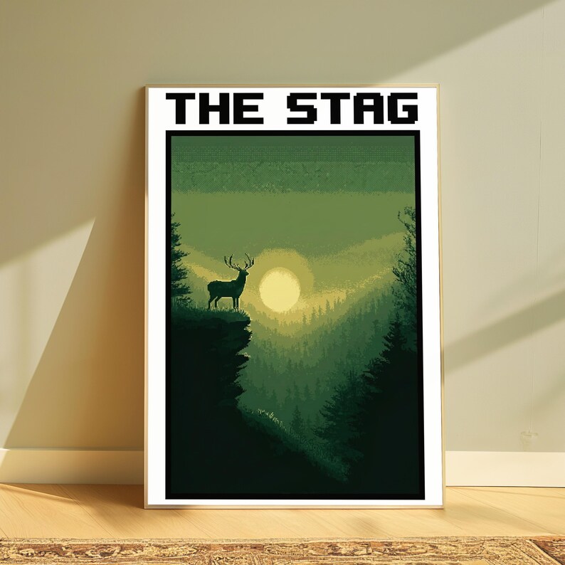 May include: A rectangular wall art print featuring the text THE STAG in a black pixelated font at the top. The artwork displays a pixel art landscape with a silhouette of a stag standing on a cliff edge overlooking a forest valley at sunset.