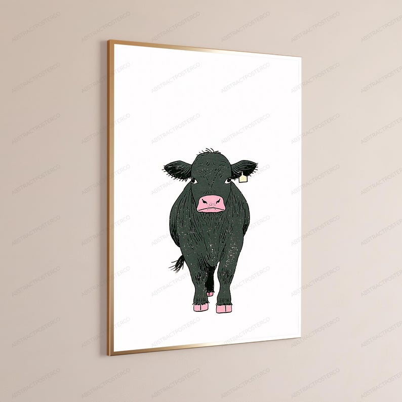 May include: A framed wall art print featuring a stylized illustration of a black cow with a pink nose and hooves, standing against a plain white background. The cow has a small yellow ear tag on its right ear and is rendered in a simple line art style.