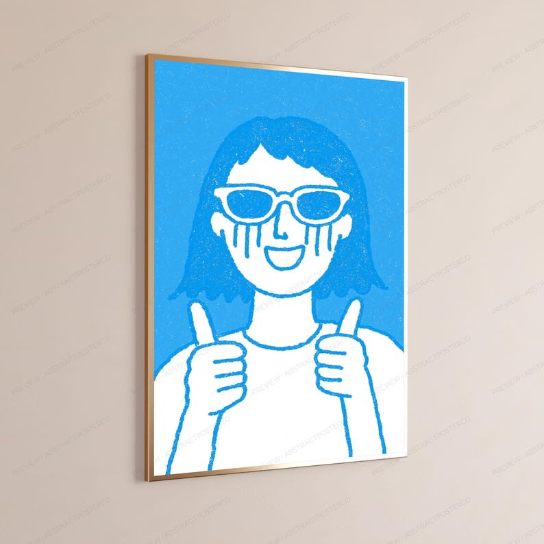May include: A framed wall art print featuring a blue and white line drawing of a person with short hair wearing sunglasses, crying blue tears, and giving a double thumbs-up gesture. The illustration has a textured, hand-drawn aesthetic.