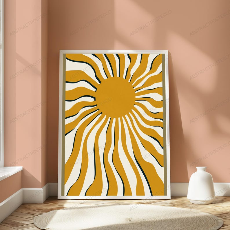 May include: A rectangular framed wall art print featuring a central solid mustard yellow circle surrounded by radiating wavy lines in alternating mustard yellow, cream, and thin black colors, enclosed within a simple white frame border.