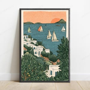 May include: A framed art print featuring a coastal scene with white buildings nestled among green trees and bushes. The blue sea is filled with several sailboats under a soft orange sunset sky. The illustration uses a textured, graphic style.