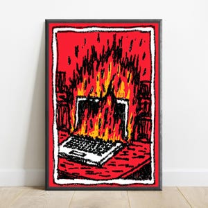 May include: A framed art print featuring a stylized illustration of a laptop engulfed in bright yellow and orange flames. The background is a vibrant red, and the entire scene is outlined with a thick, textured black and white border.