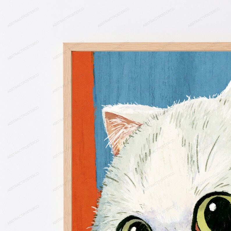 May include: A framed wall art print featuring a white cat with large green eyes. The background consists of a vertical orange stripe on the left and a textured blue section on the right. The artwork is enclosed in a light-colored wooden frame.
