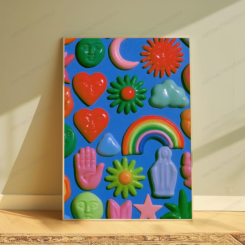 May include: A rectangular wall art print featuring a vibrant blue background covered in a repeating pattern of glossy, three-dimensional icons including red hearts with faces, green suns, a rainbow, pink hands, stars, clouds, and crescent moons.