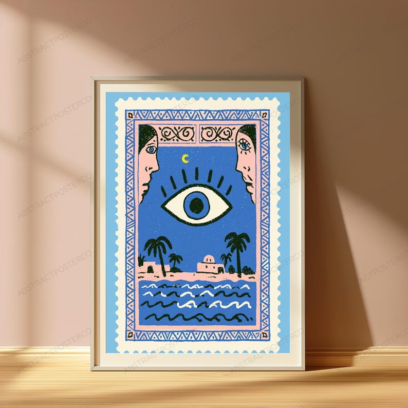 May include: A rectangular wall art print designed like a postage stamp featuring a blue sky with a large central eye, a yellow crescent moon, and two faces in profile. Below, palm trees, buildings, and wavy blue water are depicted in a frame.
