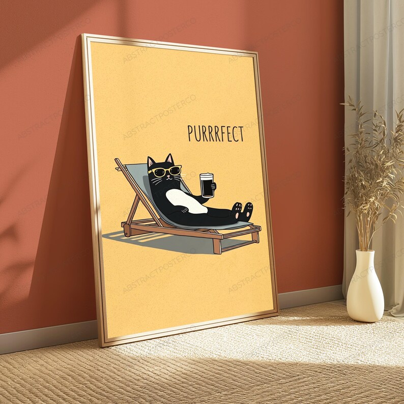 May include: A framed wall art print featuring a yellow background with a black and white cat wearing yellow sunglasses, lounging on a wooden deck chair while holding a dark beverage. The text PURRRFECT is printed in black above the cat.