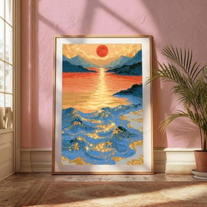 May include: A framed wall art print depicting a landscape with a large red sun setting over a calm body of water between dark blue mountains. The foreground features stylized blue ocean waves with gold glitter accents and small starfish shapes.