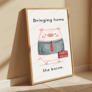 May include: A framed wall art print featuring a cartoon pig wearing a grey suit jacket and a red striped tie, holding a brown briefcase. The text above the pig reads Bringing home and the text below the pig reads the bacon in black font.