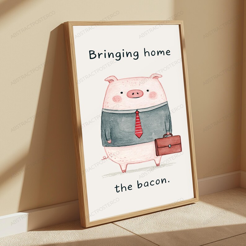 May include: A framed wall art print featuring a cartoon pig wearing a grey suit jacket and a red striped tie, holding a brown briefcase. The text above the pig reads Bringing home and the text below the pig reads the bacon in black font.