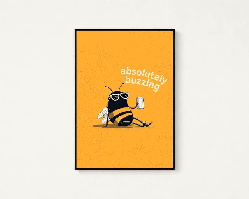 May include: A rectangular wall art print featuring a yellow background with a black and yellow striped bee wearing white sunglasses. The bee is sitting and holding a silver can. The text absolutely buzzing is printed in white above the bee.