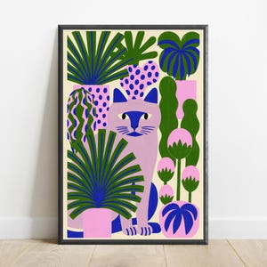 May include: A framed art print featuring a light purple cat centered among various potted plants. The plants have dark green, blue, and pink foliage in patterned pots. The background is a cream color, and the frame is a simple black border.