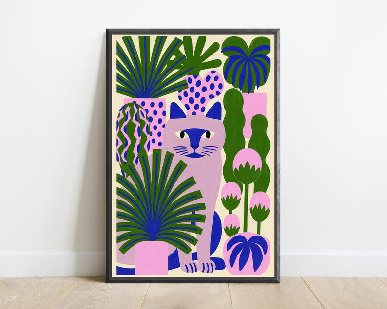 May include: A framed art print featuring a light purple cat centered among various potted plants. The plants have dark green, blue, and pink foliage in patterned pots. The background is a cream color, and the frame is a simple black border.
