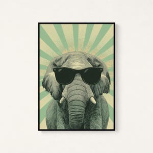 May include: A framed wall art print featuring a detailed illustration of an elephant wearing black sunglasses. The elephant is centred against a background of radiating light green and cream-coloured sunburst stripes with a dotted texture.
