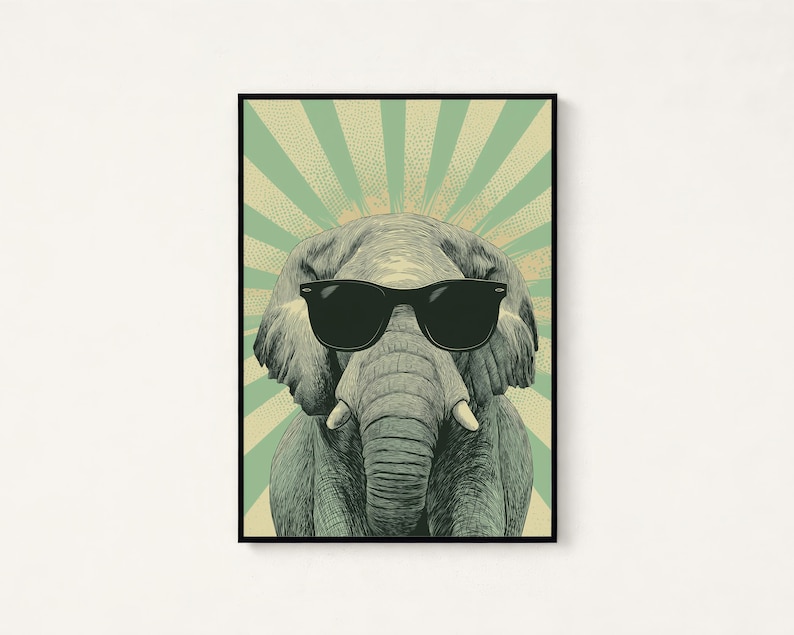 May include: A framed wall art print featuring a detailed illustration of an elephant wearing black sunglasses. The elephant is centred against a background of radiating light green and cream-coloured sunburst stripes with a dotted texture.