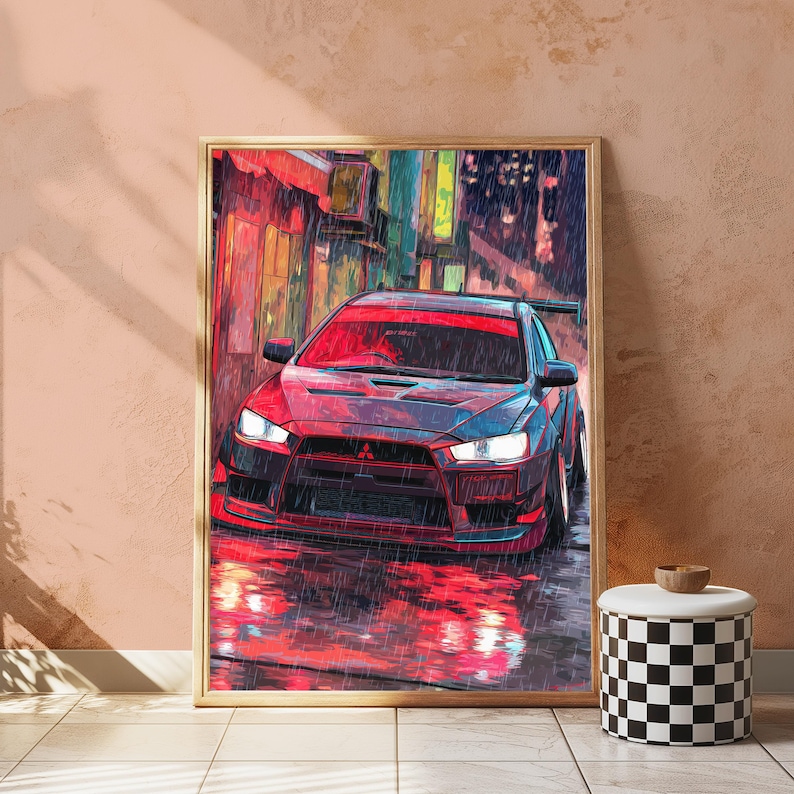 May include: A framed wall art print depicting a dark-coloured Mitsubishi Lancer Evolution saloon parked on a wet city street at night. The scene features vibrant red and blue neon lighting reflections on the rain-slicked pavement and car body.