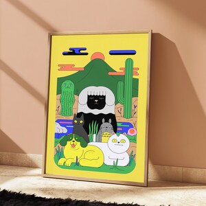 May include: A framed art print featuring a yellow background with a green mountain, a red sun, and a desert landscape. The illustration depicts a black sheep, a black cat, a grey creature, a yellow dog, and a white cat among cacti and blue water.