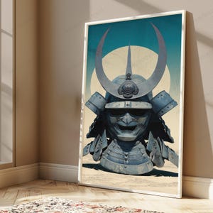 May include: A framed vertical wall art print featuring a blue-toned samurai helmet with a large crescent-shaped crest. The helmet sits against a pale yellow circular background and a teal sky. The design includes a detailed face mask with a wide grin.
