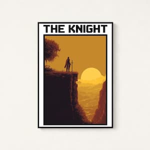 May include: A rectangular wall art print featuring the text THE KNIGHT in black pixelated font. The illustration depicts a silhouette of a knight standing on a cliff edge with a sword at sunset, overlooking a valley with orange and yellow tones.